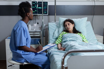 Nurse examining patient at hospital
