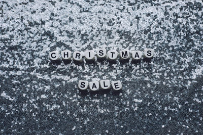 Christmas sale, black friday silver metallic background. text christmas sale on festive glitter