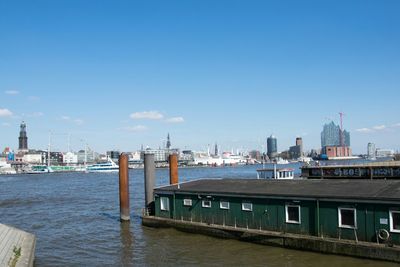 View of harbor against blue sky