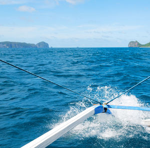 Sailboat sailing in sea against sky