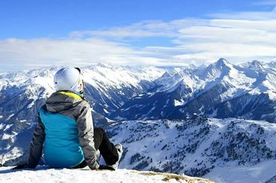 Woman standing on snow covered landscape