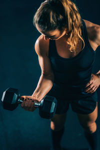 High angle view of woman exercising at gym 