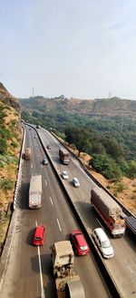 High angle view of vehicles on road against sky