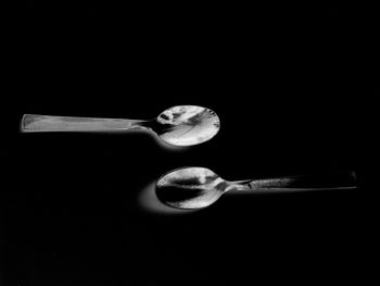 Close-up of lamp over black background