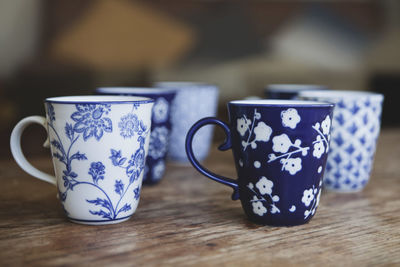 Close-up of coffee cups on table