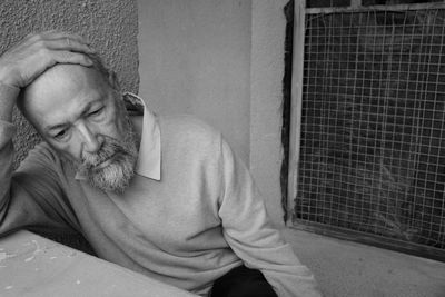 Portrait of lonely senior man looking away