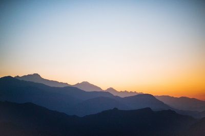 Scenic view of mountains at sunset