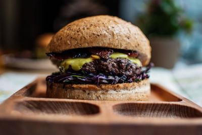 Close-up of hamburger served in brown plate
