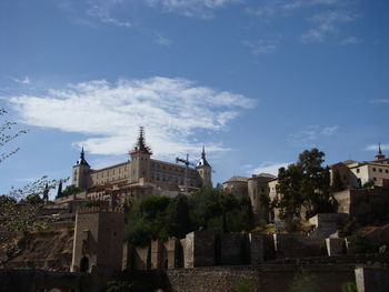 Buildings in city against sky