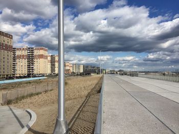 City street against cloudy sky
