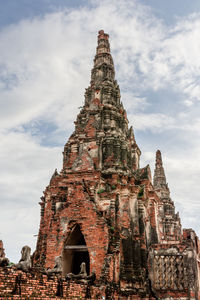 Low angle view of old building in ayutthaya province under the blue sky