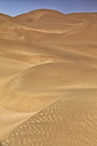 Sand dunes in desert