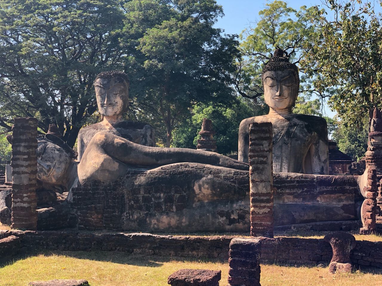 VIEW OF STATUE AGAINST TEMPLE