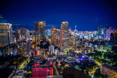 High angle view of illuminated buildings in city at night