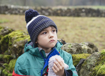 Portrait of cute boy in park during winter