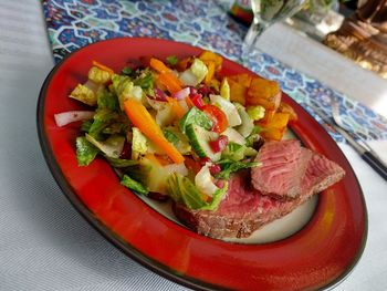High angle view of chopped vegetables in plate on table