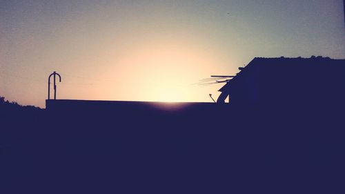 Silhouette of building at sunset