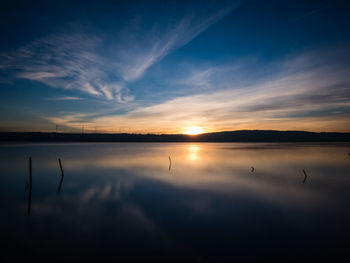 Scenic view of sea against sky at sunset