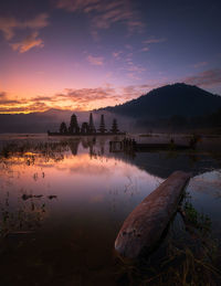 Scenic view of lake against sky during sunset