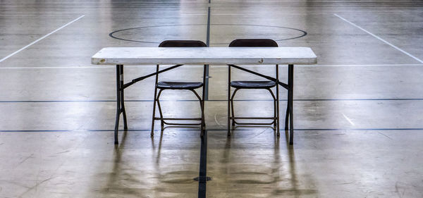 High angle view of chairs on table