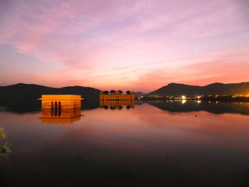 Scenic view of lake against sky during sunset