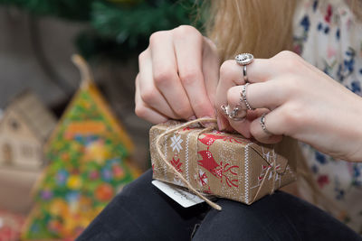 Close-up of woman holding gift boxes