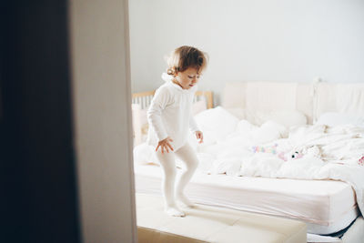 Cute boy on bed at home