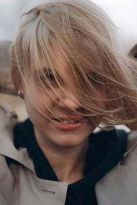 Close-up portrait of a smiling young woman