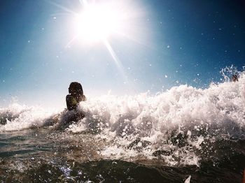 Sun shining over sea