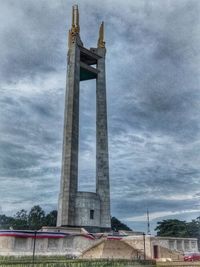 Low angle view of tower in city against sky