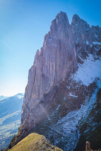 Scenic view of snowcapped mountains against clear sky