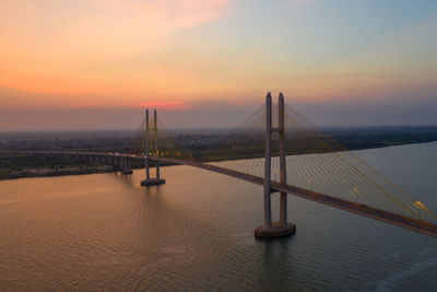 View of bridge over sea against sky during sunset