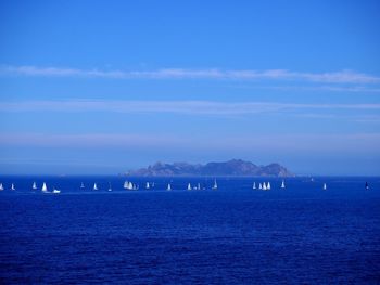 Scenic view of sea against blue sky