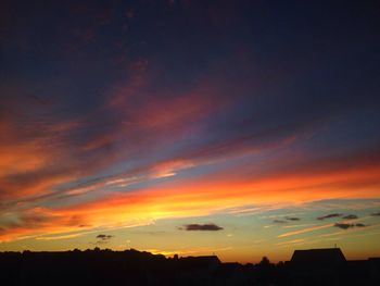 Scenic view of dramatic sky at sunset