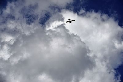 Low angle view of airplane in sky