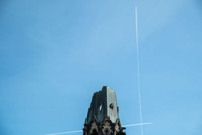 Low angle view of buildings against blue sky