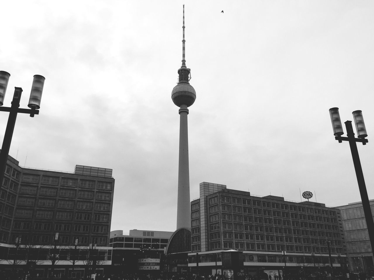 building exterior, architecture, built structure, tower, low angle view, tall - high, communication, communications tower, city, sky, spire, fernsehturm, television tower, skyscraper, culture, capital cities, street light, travel destinations, tall, office building