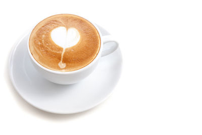 Close-up of coffee cup over white background