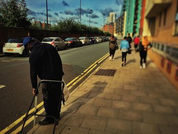 Rear view of man walking on street