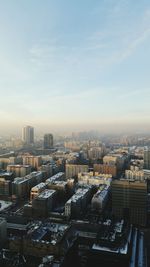 High angle view of buildings against sky in city