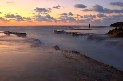 Scenic view of sea against sky during sunset