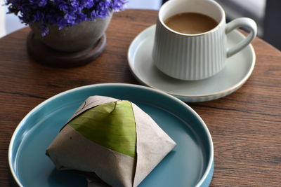 High angle view of coffee and cup on table