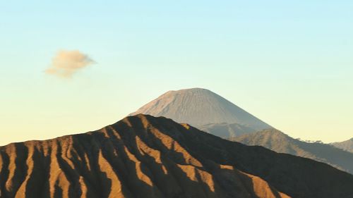 Scenic view of volcanic mountain against sky