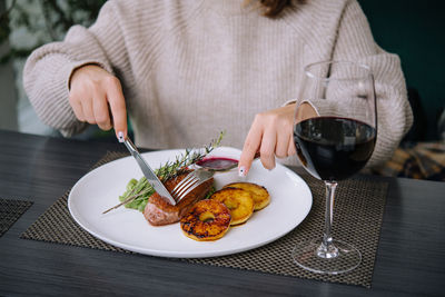 Midsection of woman having food