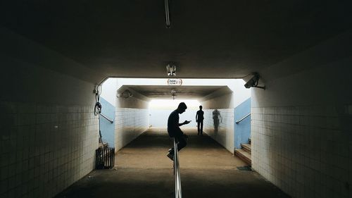 Man standing in corridor