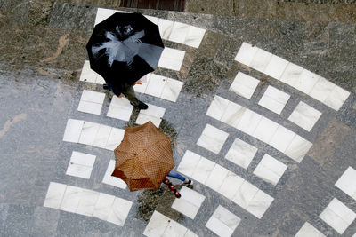 High angle view of woman standing on street