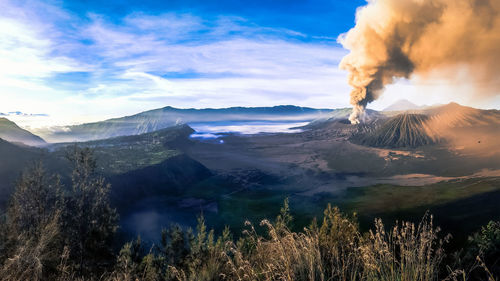 Majestic view of smoke emitting from mt bromo