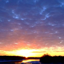 Scenic view of silhouette landscape against sky during sunset