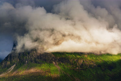 Scenic view of clouds covering mountain