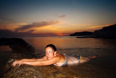 Scenic view of sea at sunset